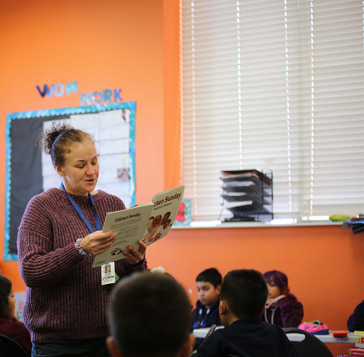 HSA McKinley Park Elementary School Teacher and student interacting at a classroom desk
